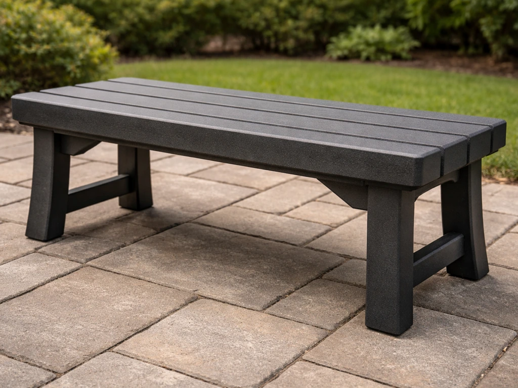 Outdoor resin/HDPE bench with molded texture and sturdy legs in natural light
