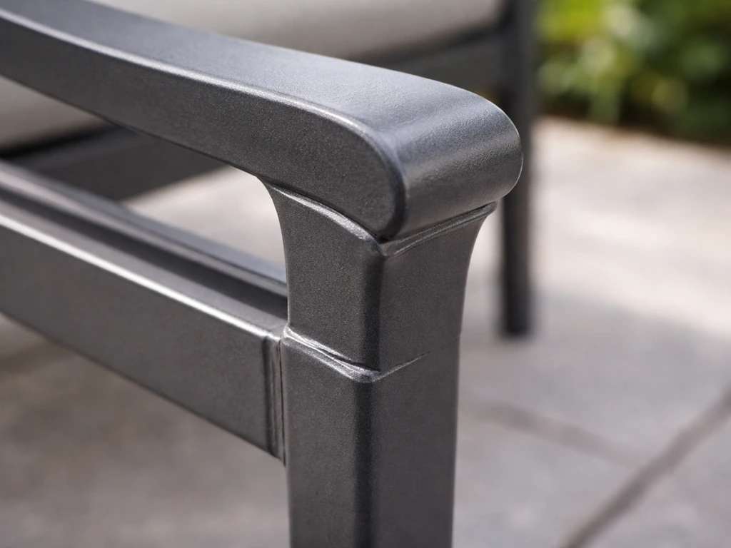 Close-up of cast/extruded aluminum patio furniture showing intact powder-coat finish and welded seams